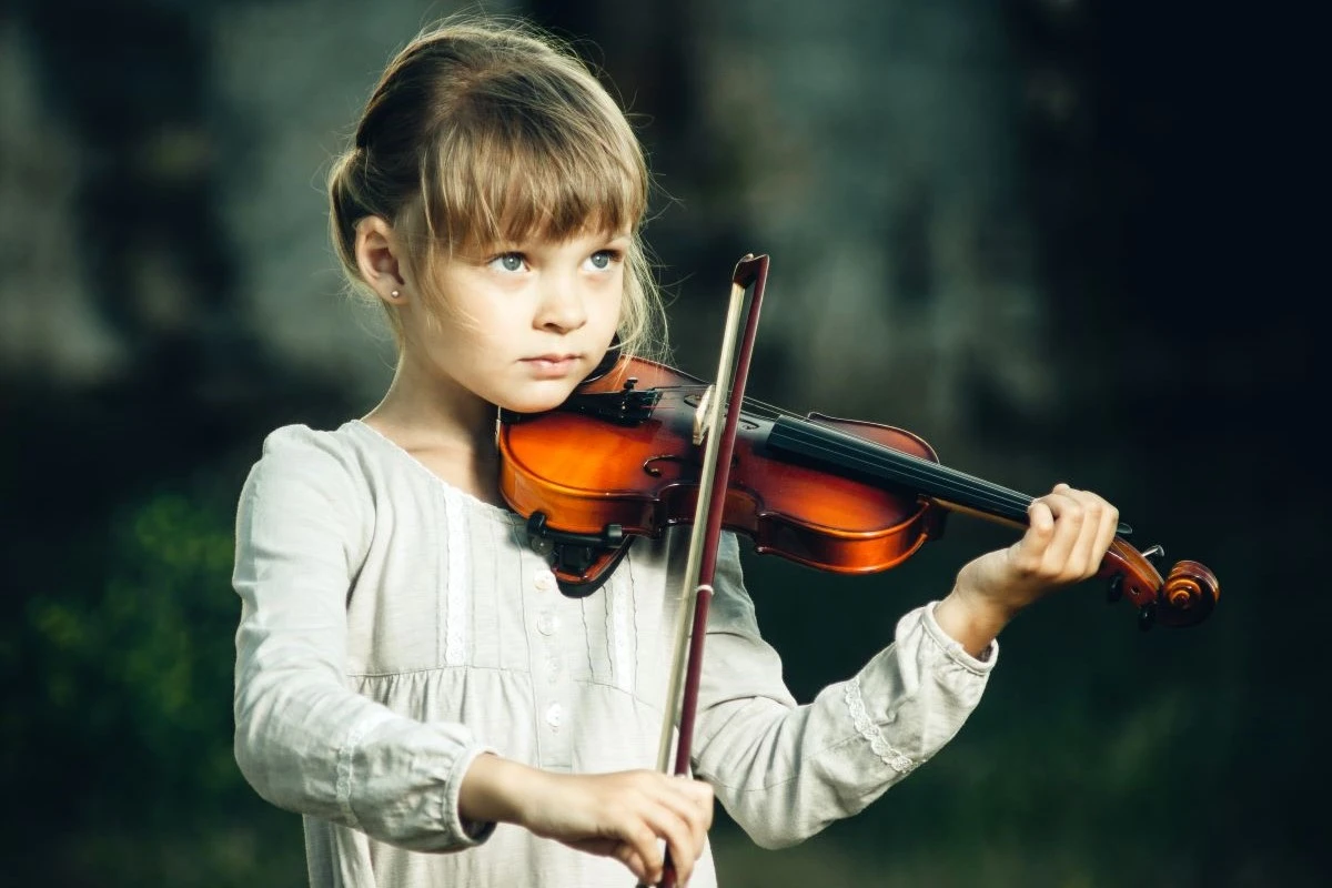 Child learns violin lesson at North London Music School