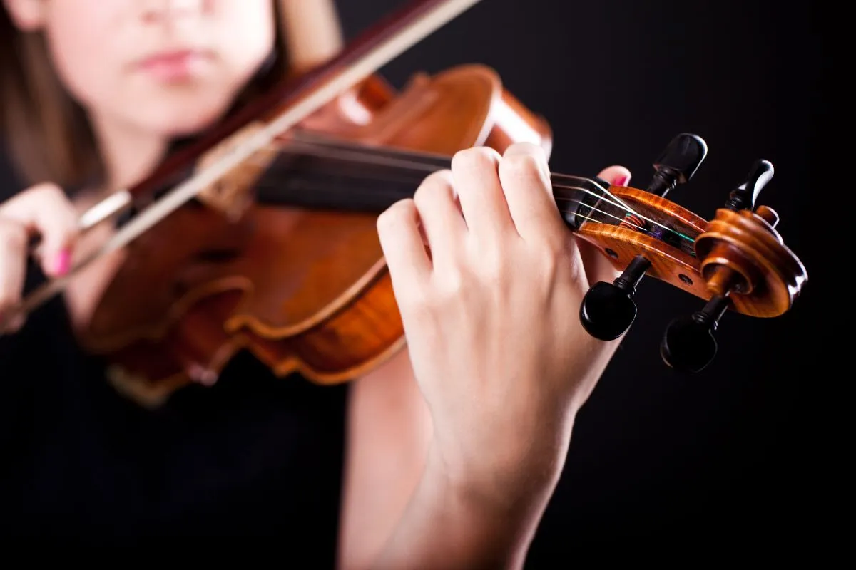 Student taking classical violin lessons