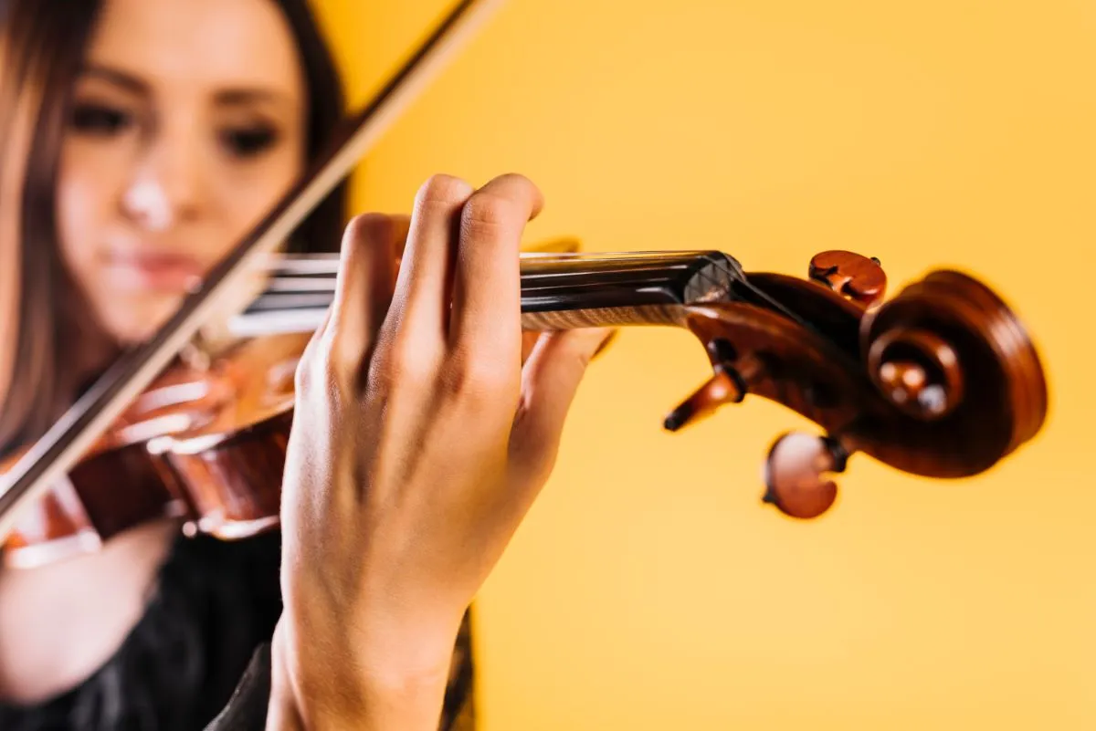 Adult playing the violin